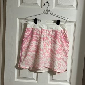#7 Nike Golf Skort. New without tags. Never worn. Colour is pink and white